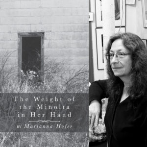 The Weight of the Minolta in Her Hand by Marianna Hofer